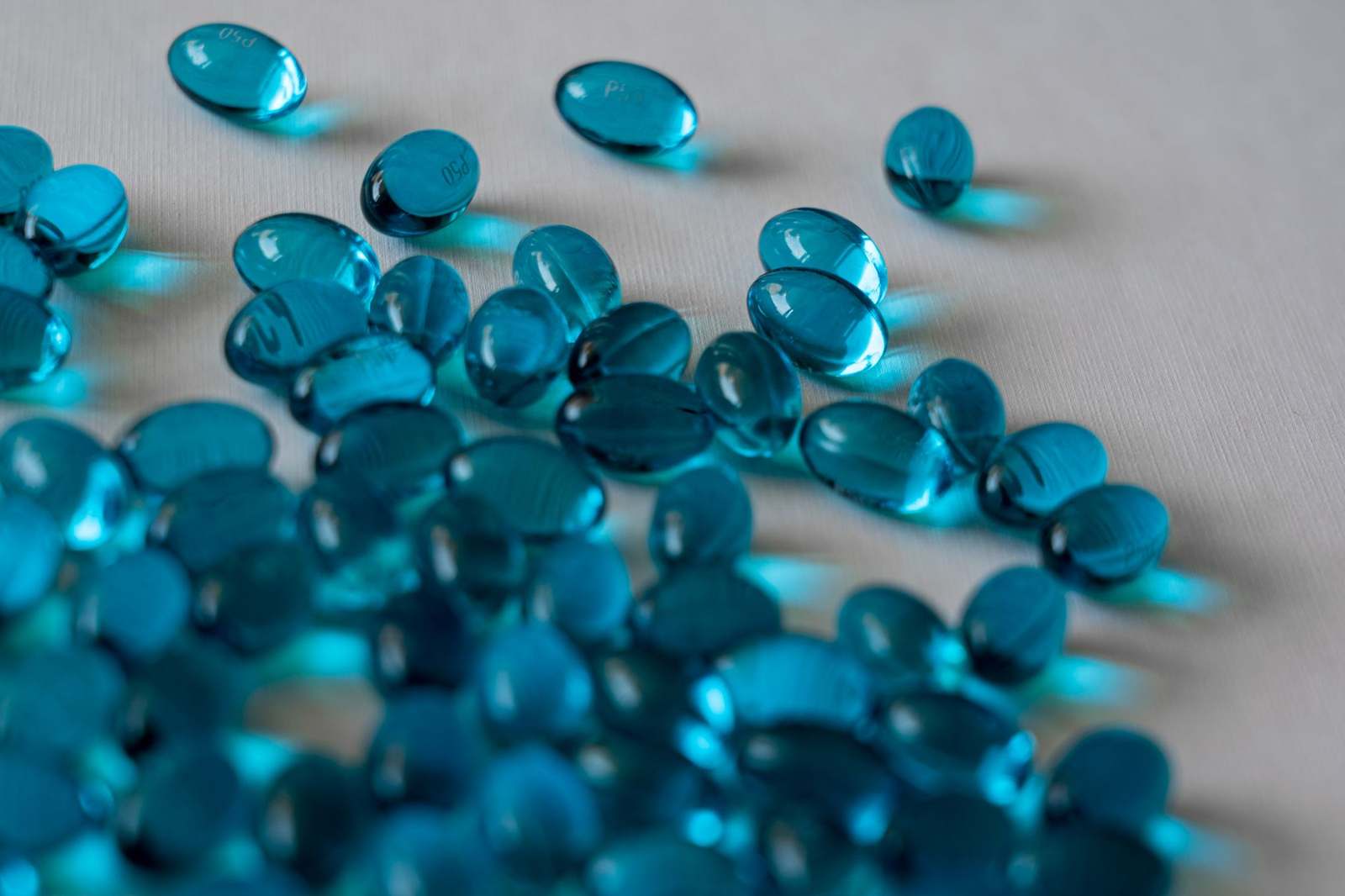 A close-up of gel capsules in pharmaceutical production