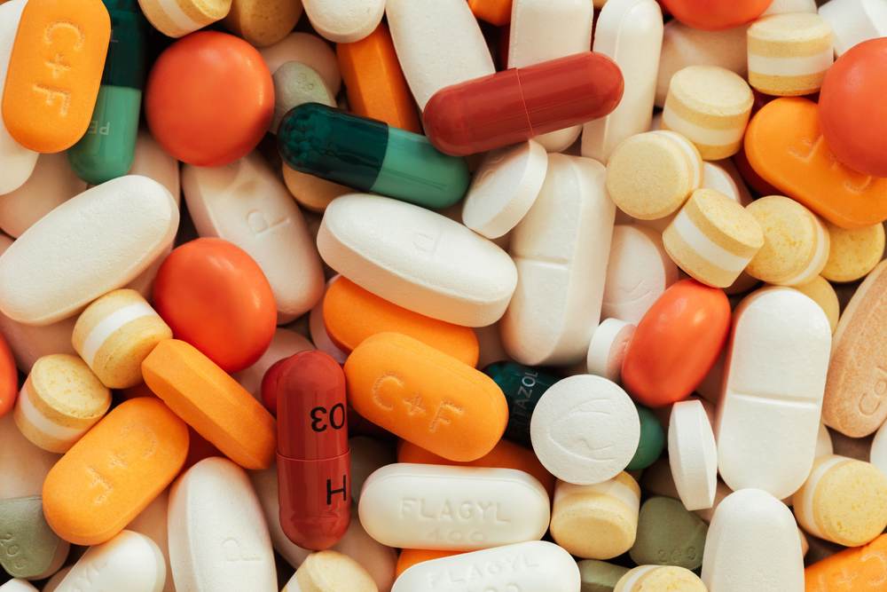 Assorted tablets and pills on a surface