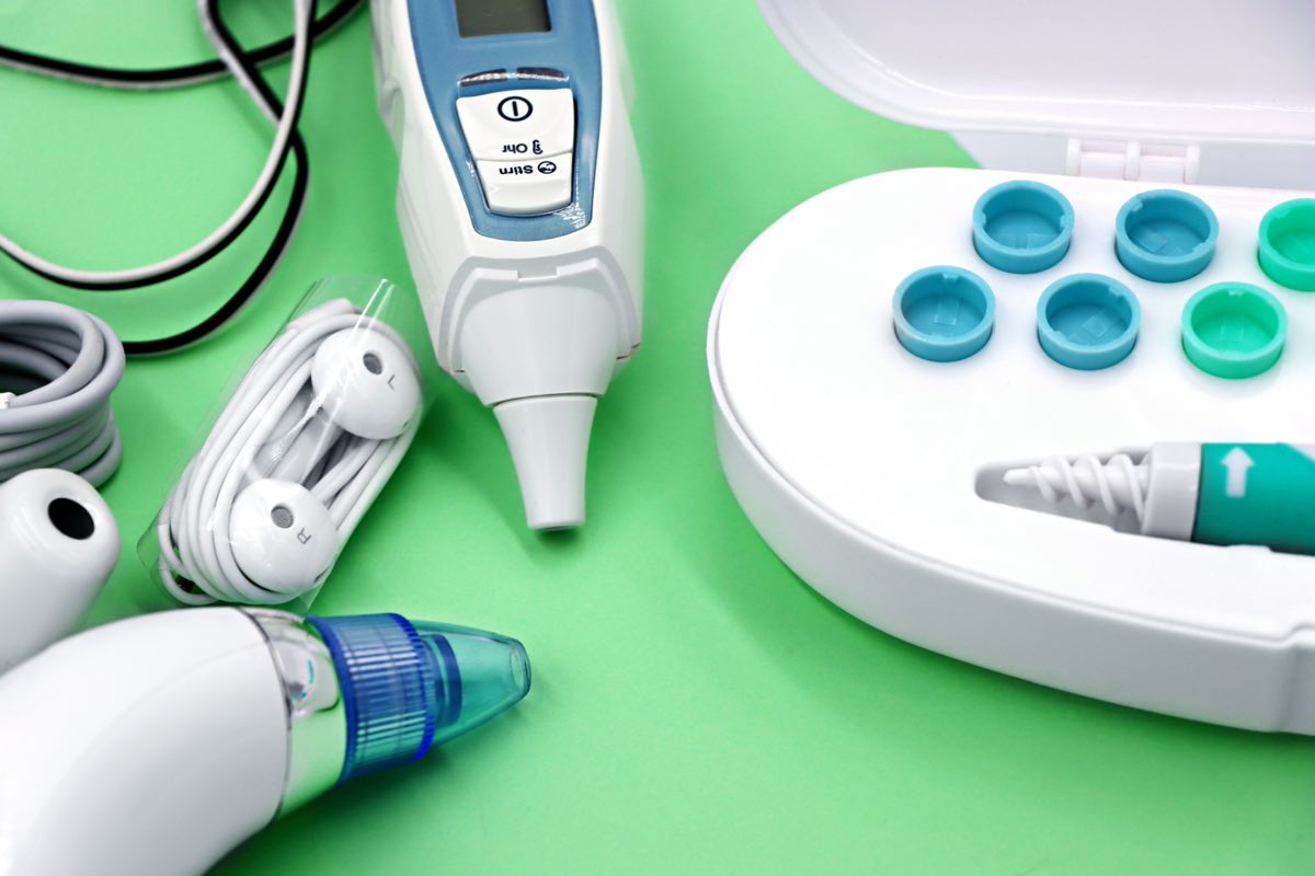 A variety of ear care devices including ear buds, medical instruments, and cleaning tools