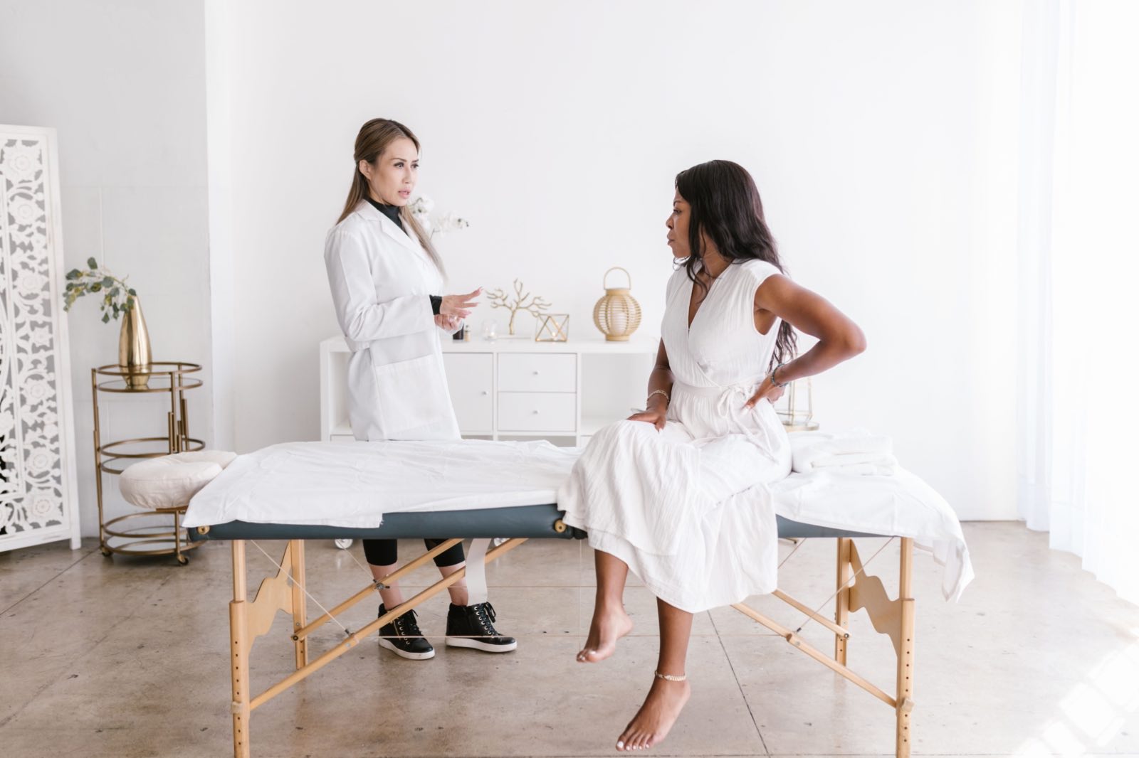 A doctor consulting a patient in a well-lit modern office setting