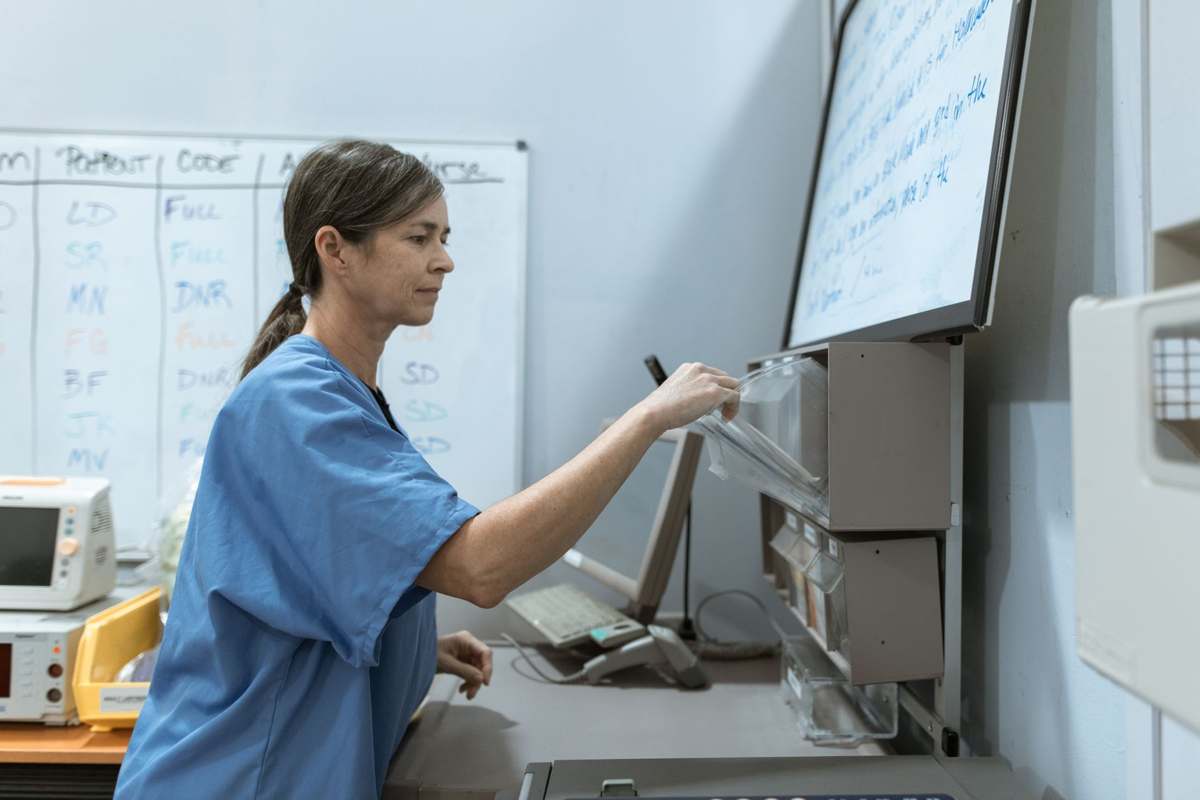 A nurse working at a hospital monitoring station