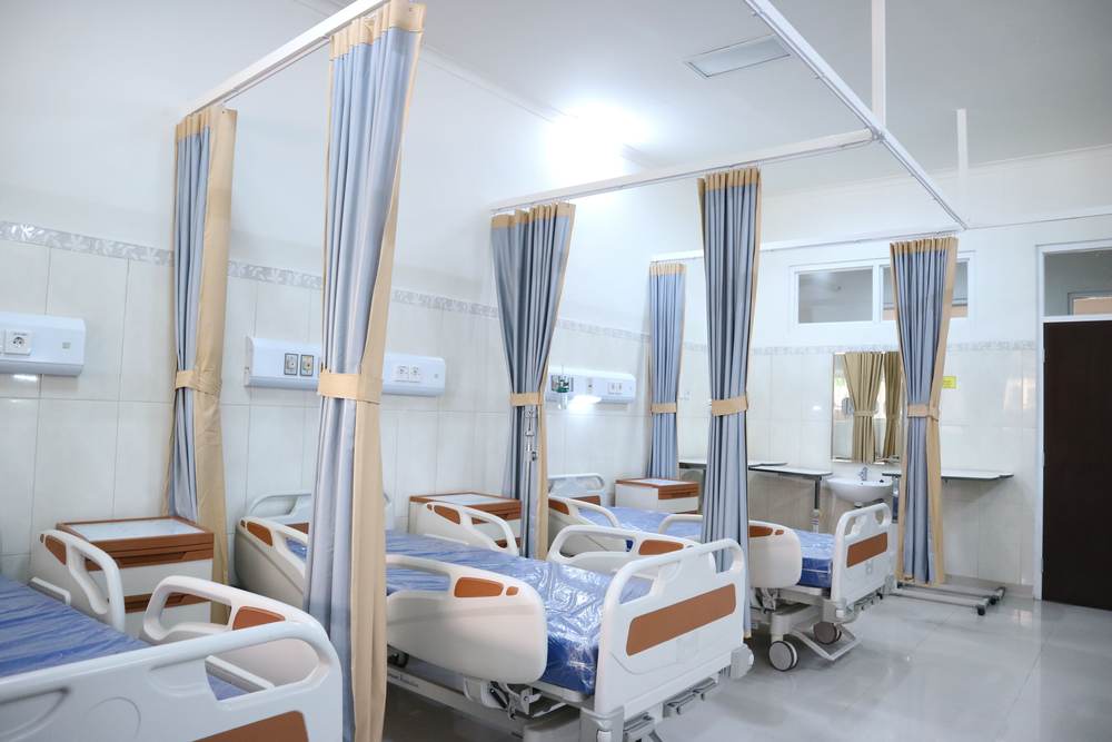 A hospital ward with modern monitoring equipment
