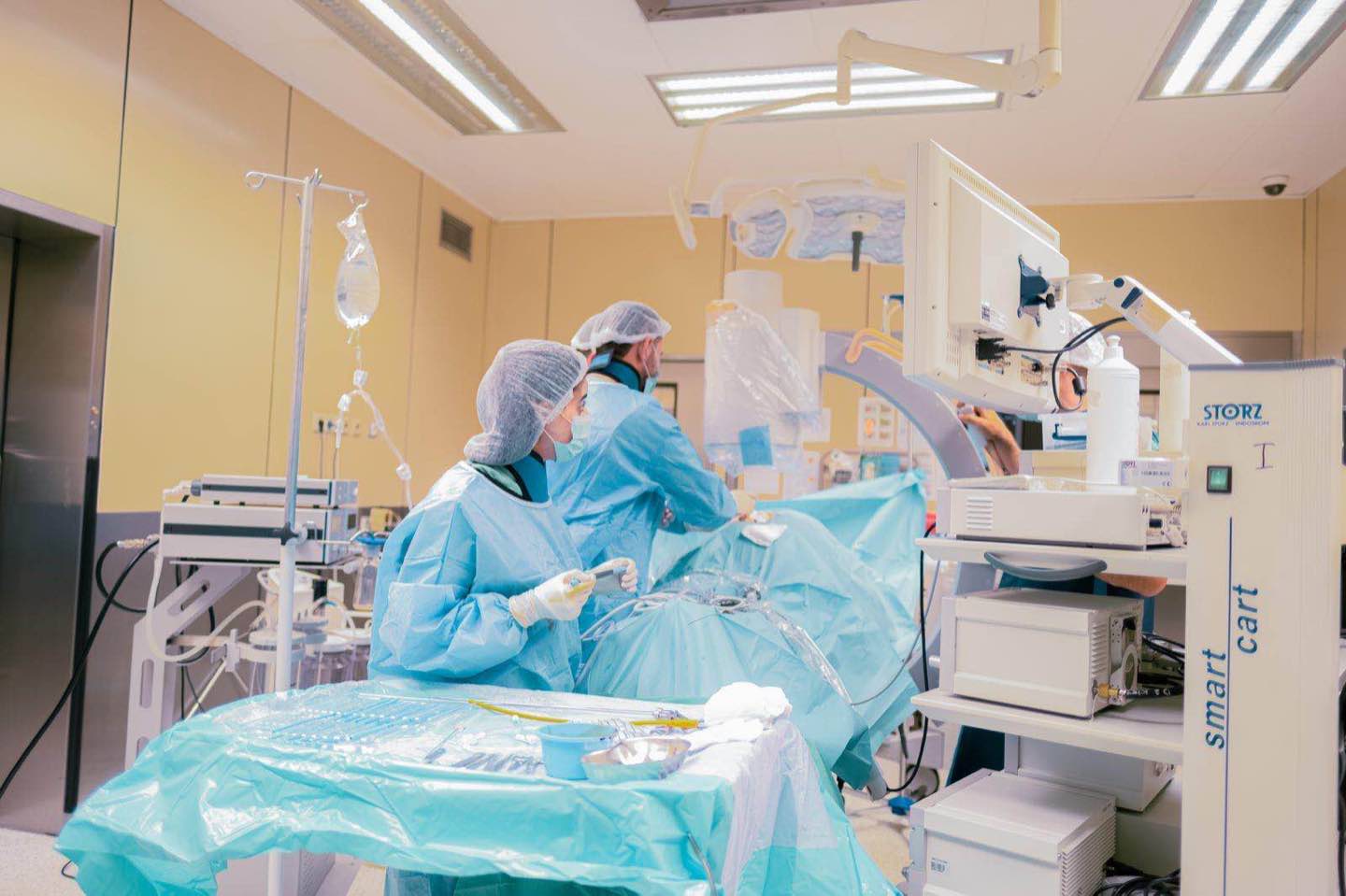 A surgical team at work in a fully equipped operating room
