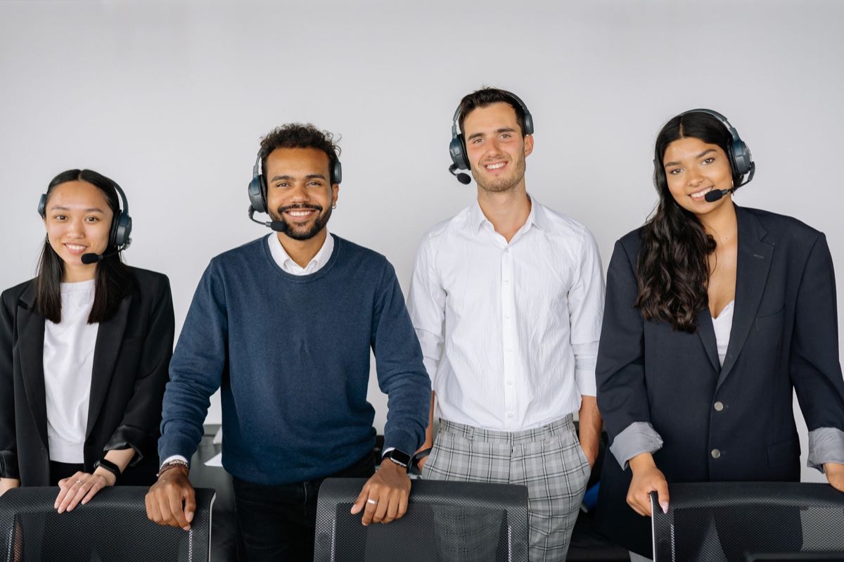 Customer service team wearing headsets receiving calls