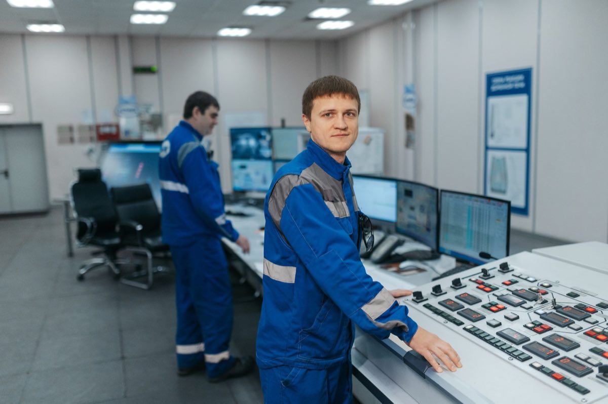 Operators monitoring signals from the field in a control room