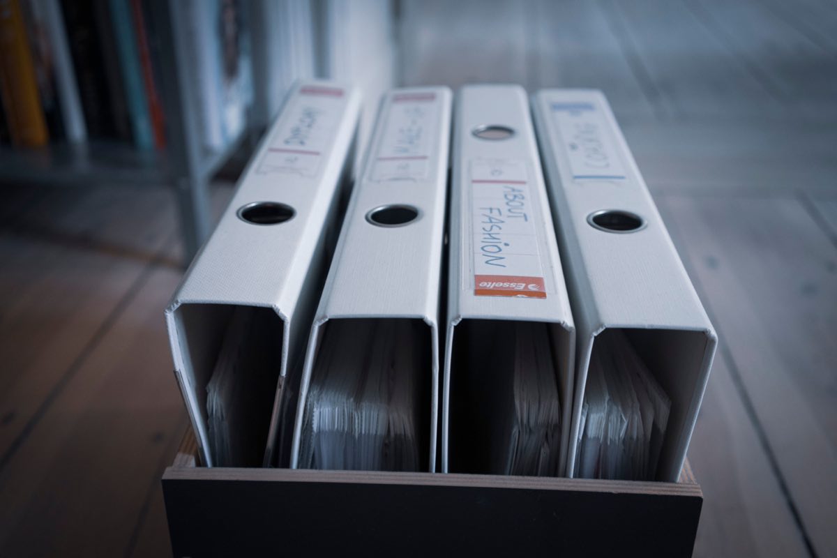 A row of quality-system binders and documentation in an office