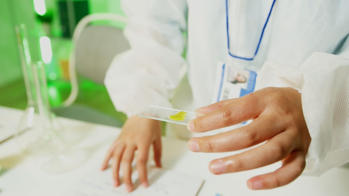Rare-disease regulatory scientist reviewing genetic data