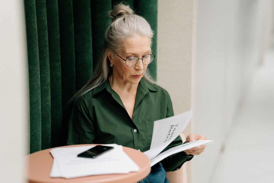 Senior regulatory analyst reading a curated intelligence briefing