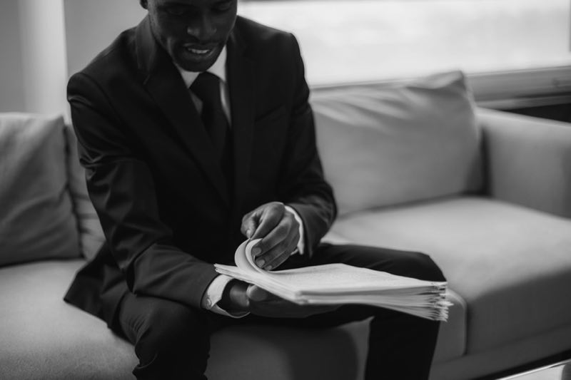 Executive reading a monthly regulatory intelligence briefing