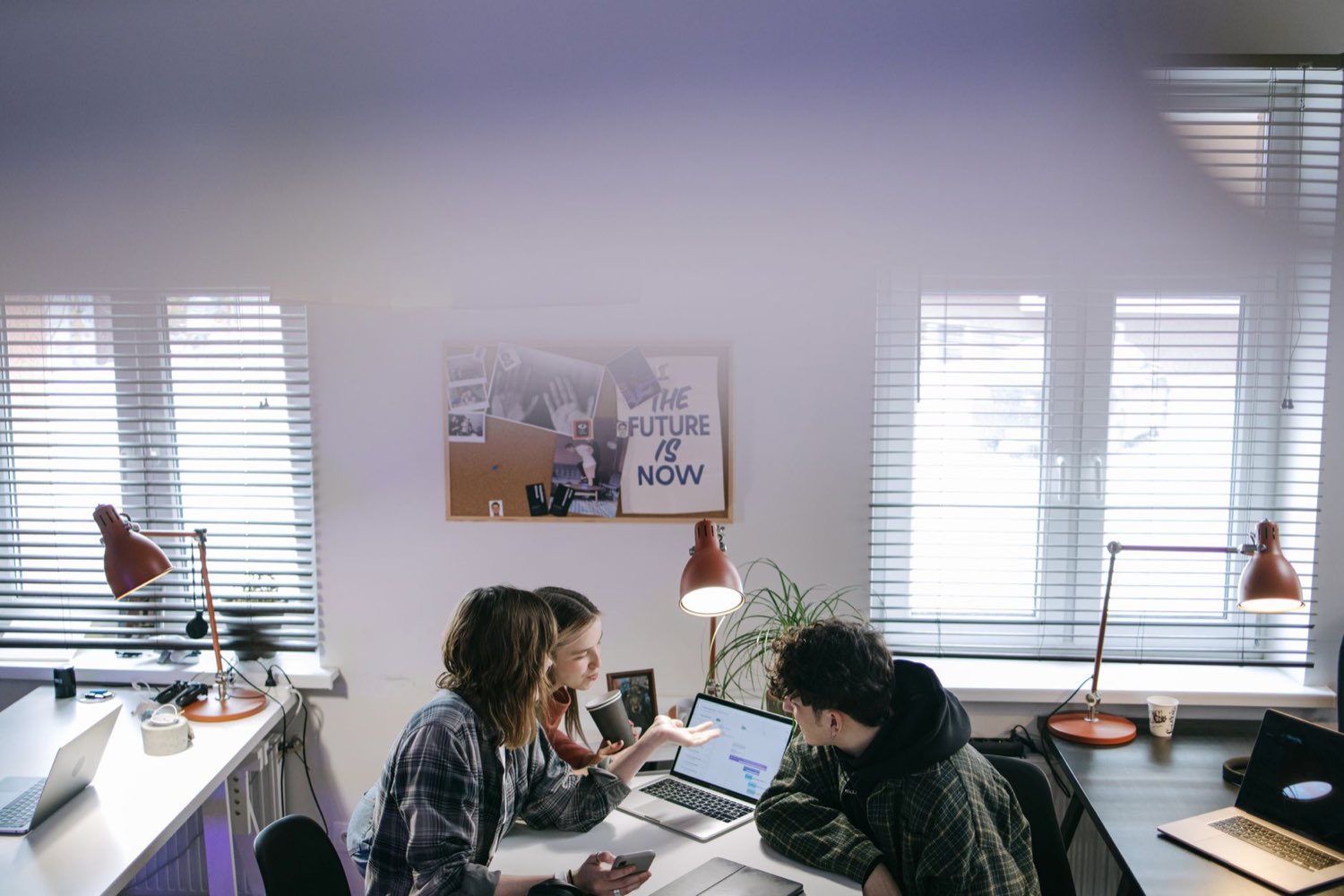 A regulatory operations team collaborating in an office