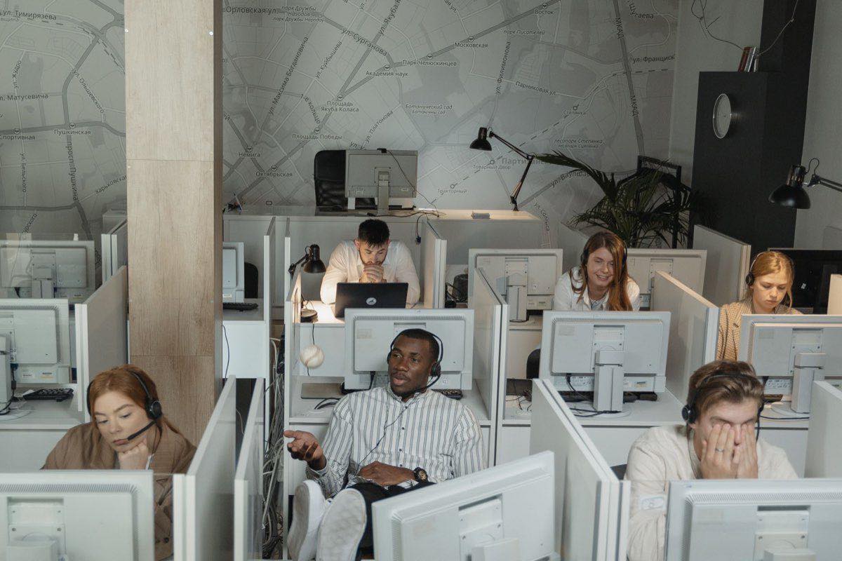A regulatory operations team at their workstations