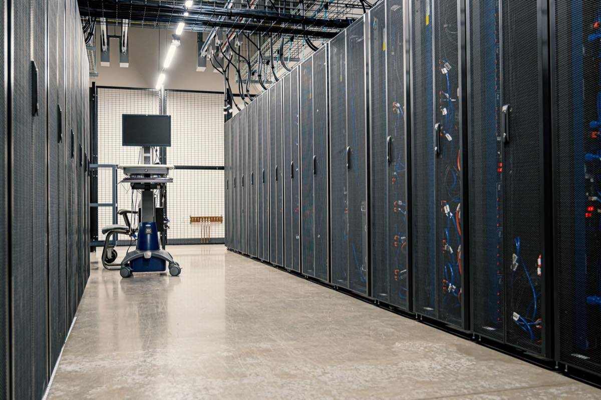 Data center racks representing the regulatory information systems behind every filing