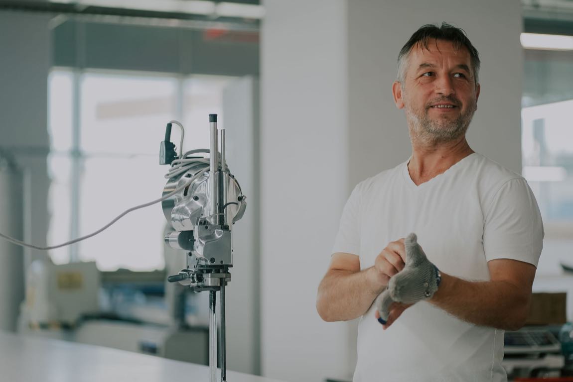 An engineer inspecting a medical device in a manufacturing setting