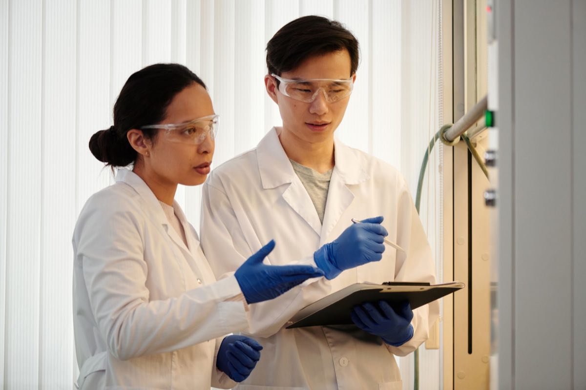 Researchers examining data together in a laboratory
