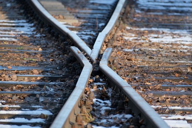 Railway tracks converging at a switch point