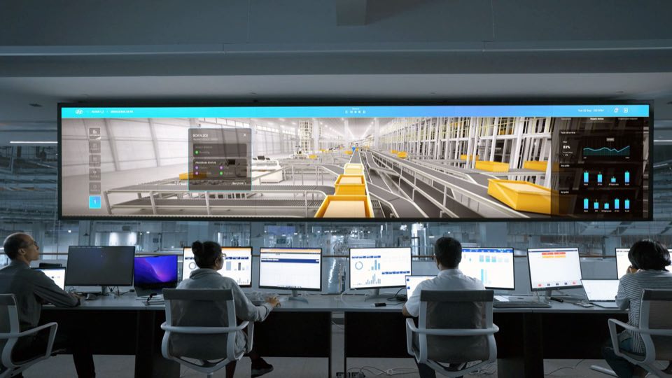 Operations team monitoring large surveillance displays