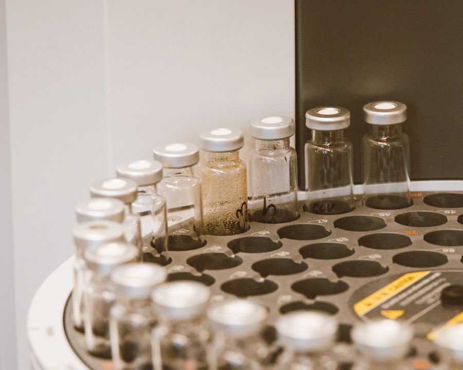 Sterile glass vials racked in a pharmaceutical facility