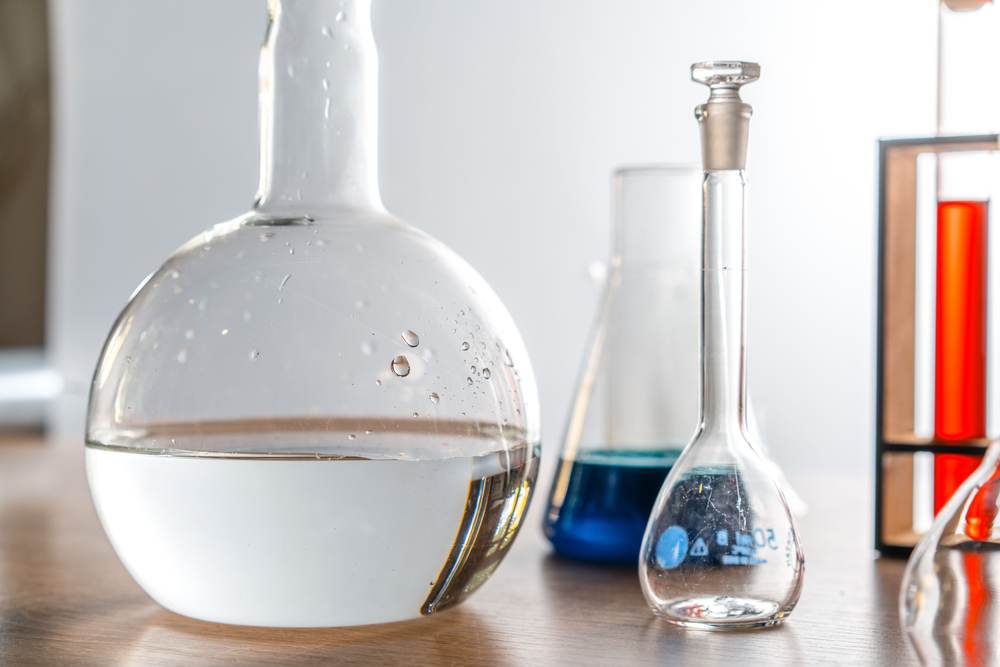 Close-up of laboratory glassware with chemical solutions