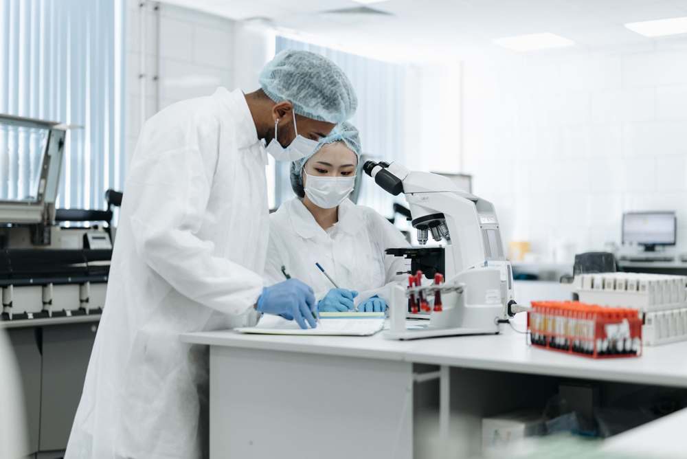 Scientists reviewing data together in a pharmaceutical laboratory