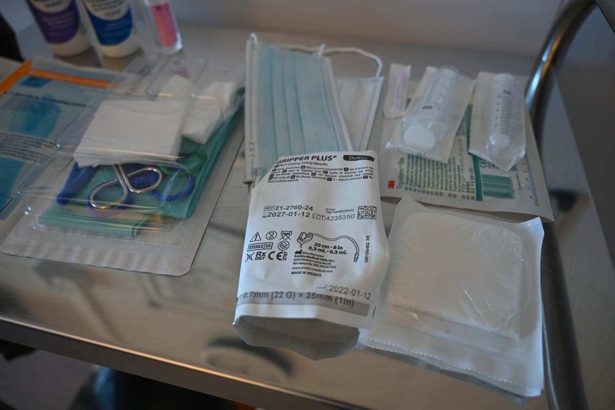 Assorted sterile medical supplies laid out on a table