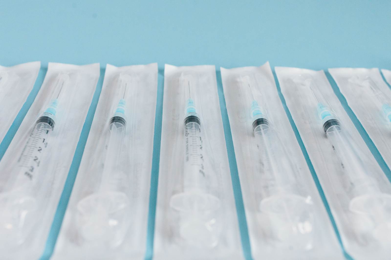 An array of sterile syringes in individual packaging