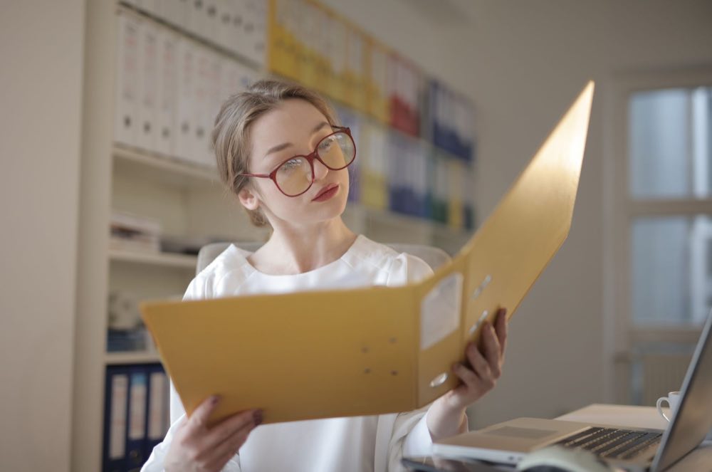Supplier auditor reviewing a qualification file