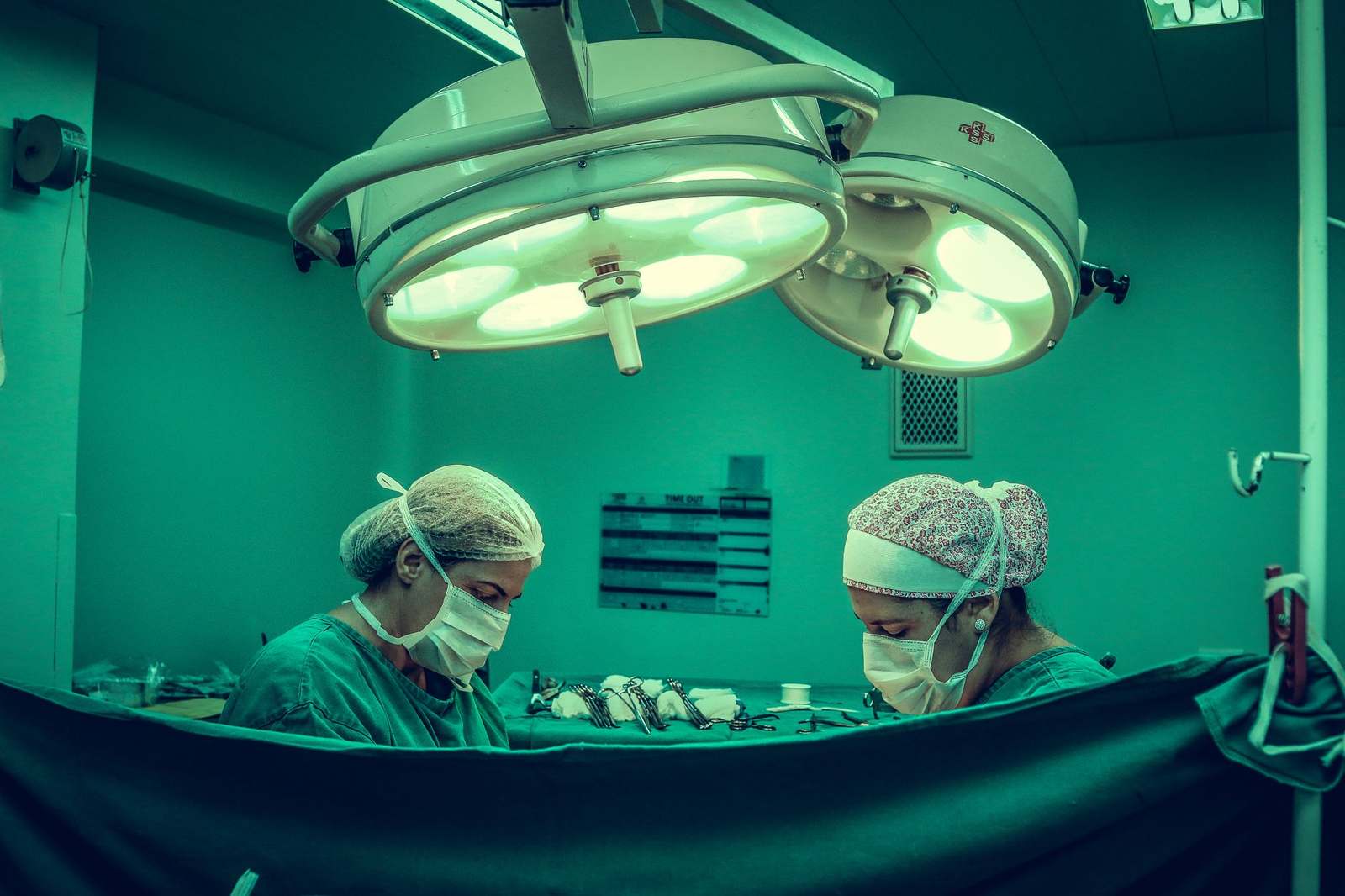 Surgeons conducting a procedure in an operating room