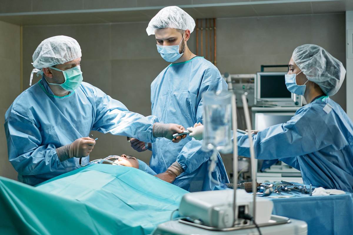 A medical team performing surgery in a well-equipped operating room