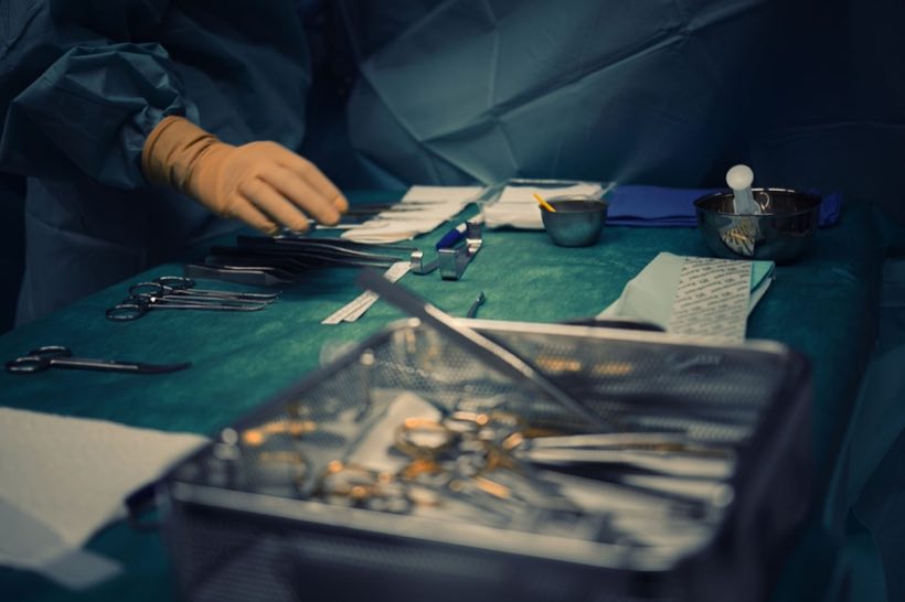 Close-up of surgical instruments prepared for surgery in a hospital operating room