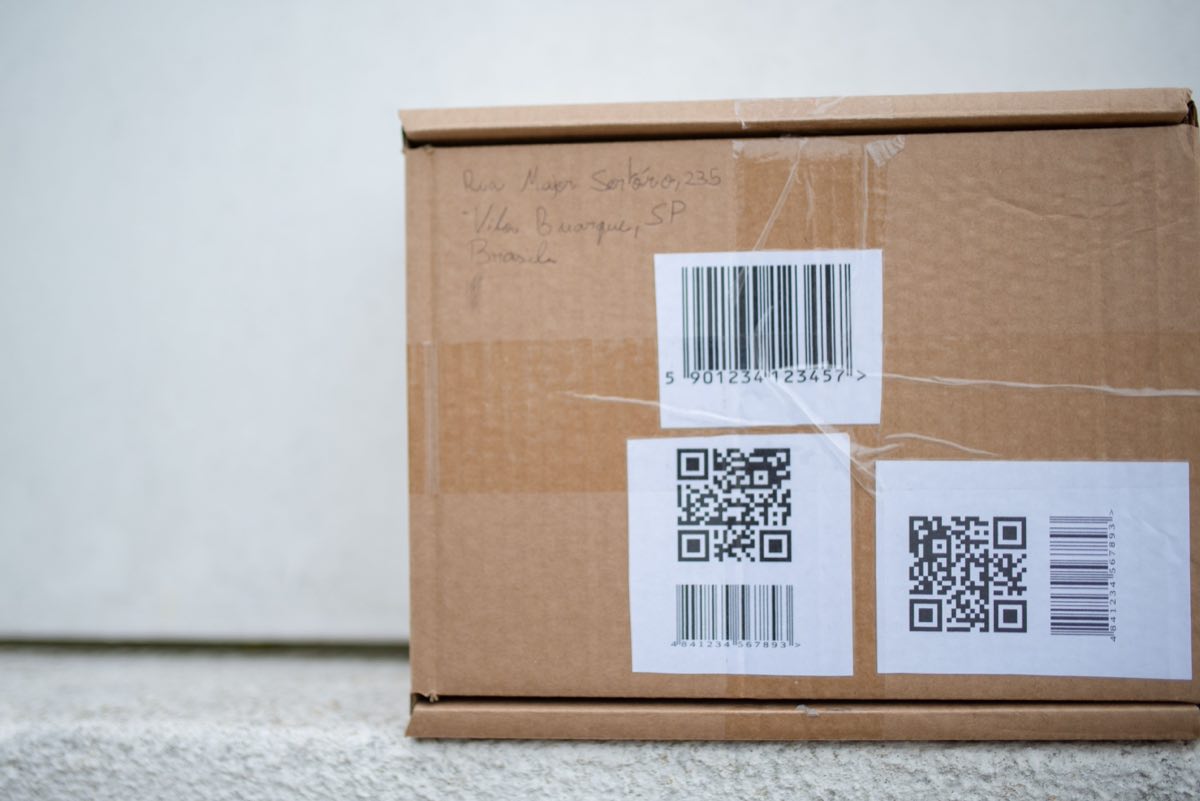 A close-up of a barcode label being printed on an industrial line