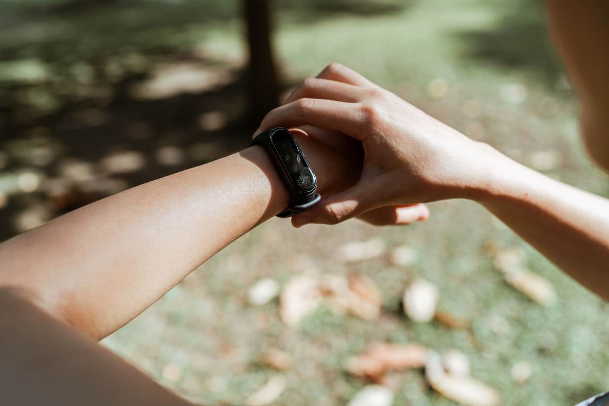 A person demonstrating a wearable device on the wrist